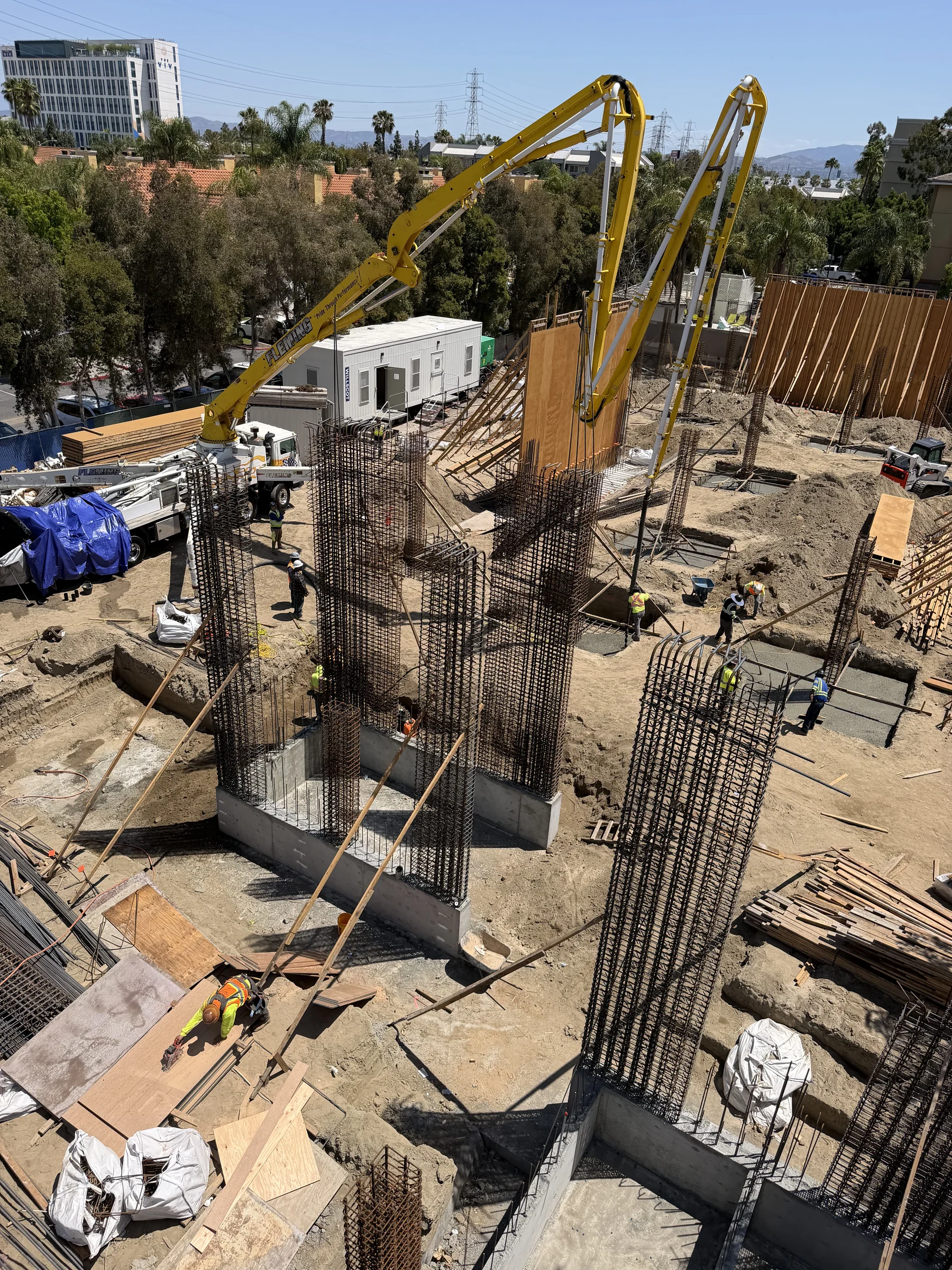 Mixed-use podium deck rebar columns and structural concrete support in Southern California